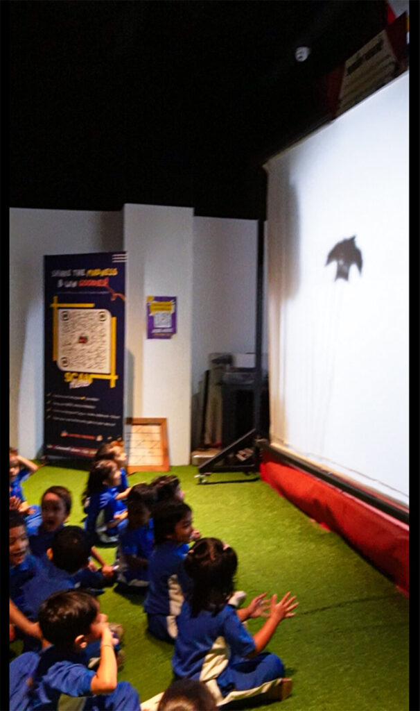 Students watching interactive shadow storytelling at MAD Talkies in MAD Labs