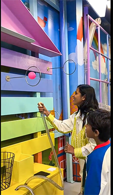 Kids experimenting with air pressure and balls in Tech Mech Lab at MAD Labs