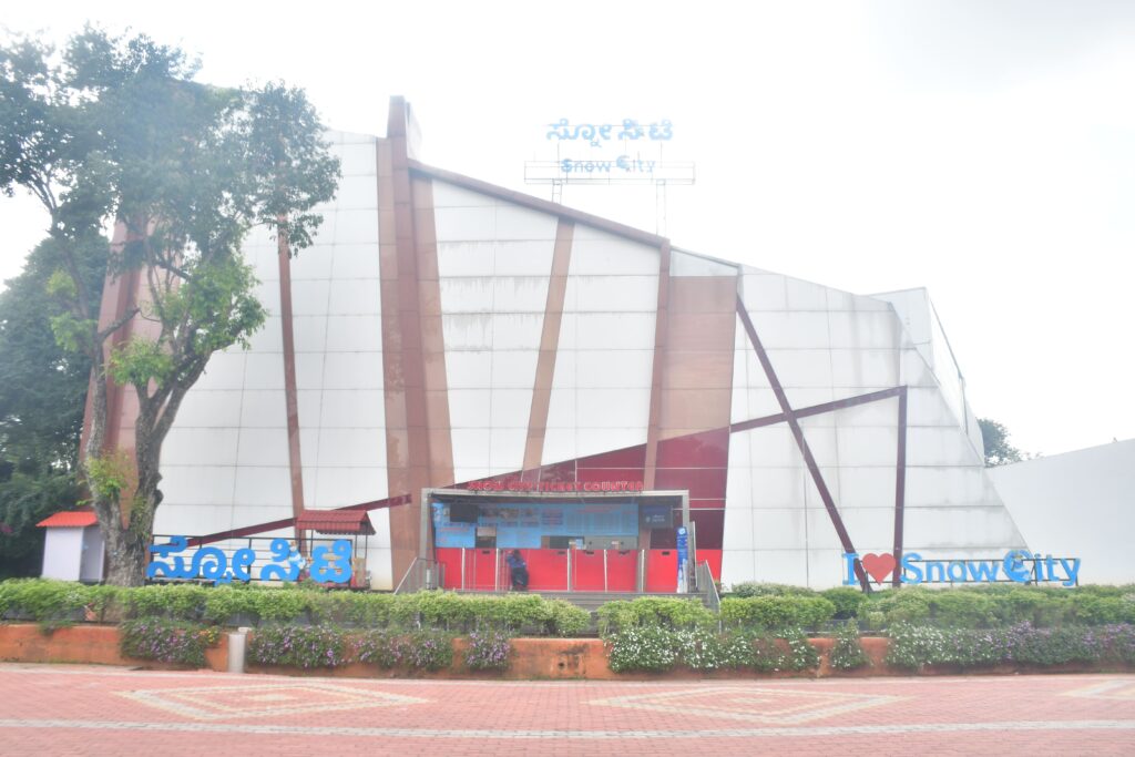 Front view of Snow City Bangalore building with ticket counter and 'I Love Snow City' sign at the entrance.